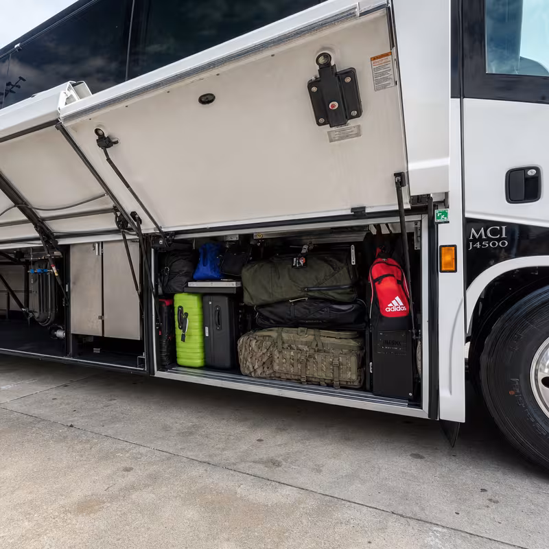 Party bus interior with wraparound leather seating and LED lighting in Santa Clarita