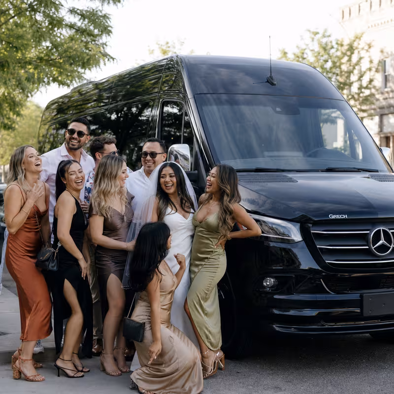 Group boarding a white charter bus for Bachelor & Bachelorette Transportation transportation in Santa Clarita