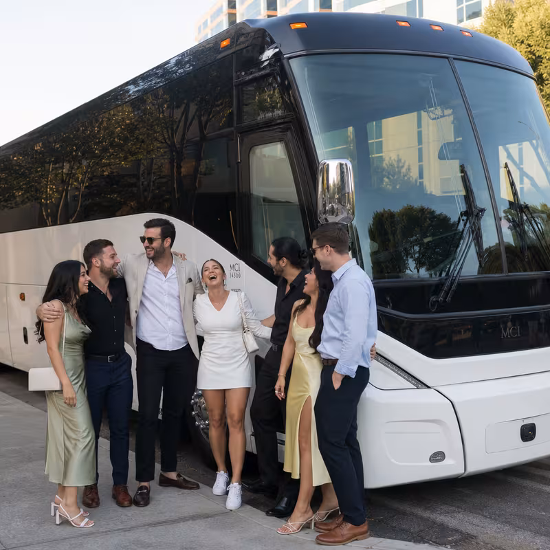 Passengers loading luggage while boarding an Santa Clarita group shuttle
