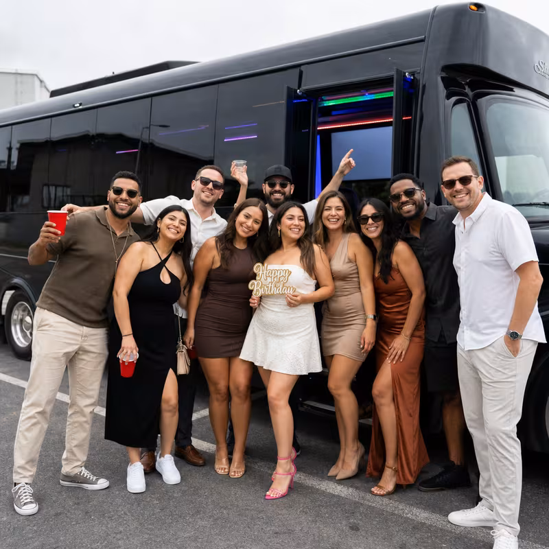 Party bus interior with wraparound leather seating and LED lighting in Santa Clarita
