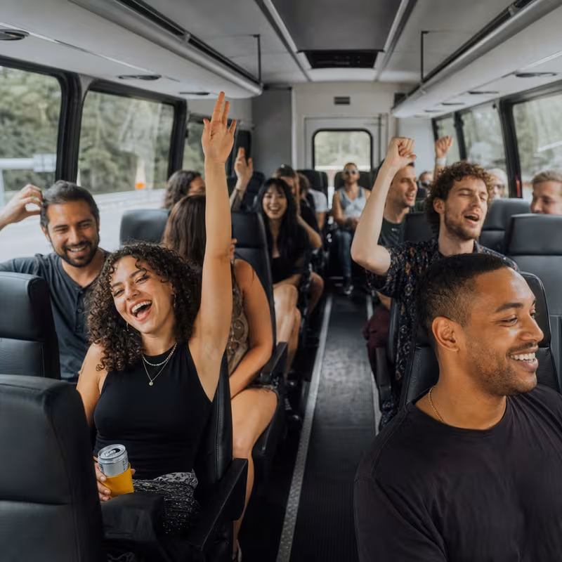 Party bus interior with wraparound leather seating and LED lighting in Santa Clarita