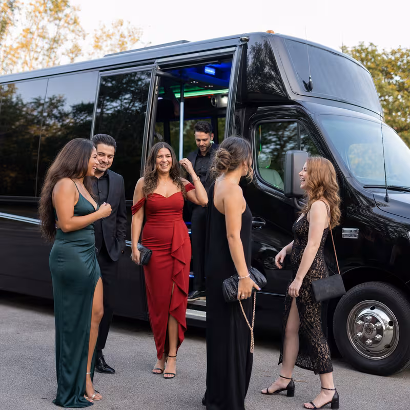 Passengers loading luggage while boarding an Santa Clarita group shuttle