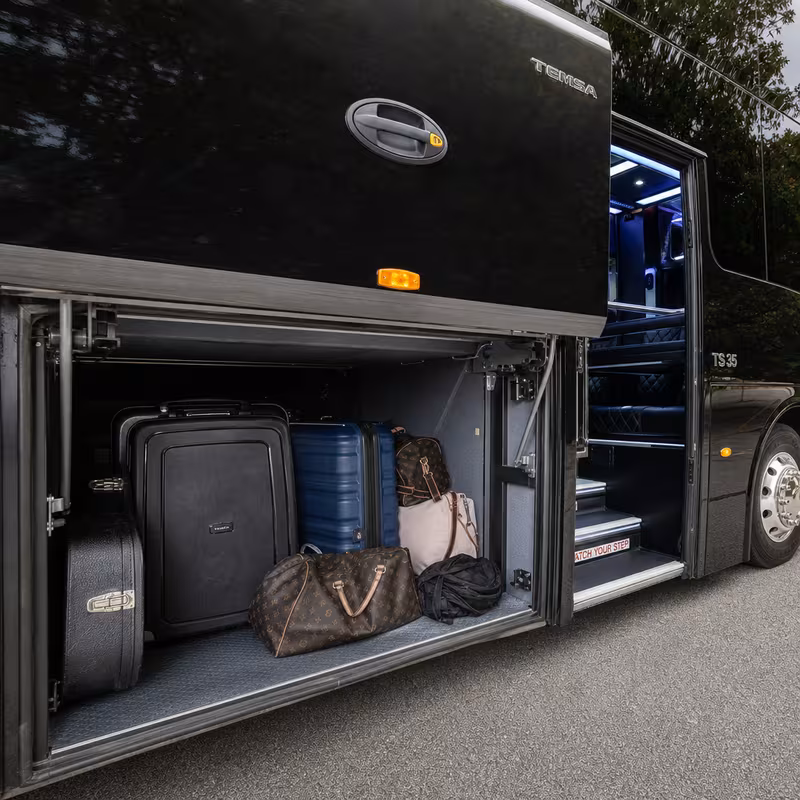 Party bus interior with wraparound leather seating and LED lighting in Santa Clarita