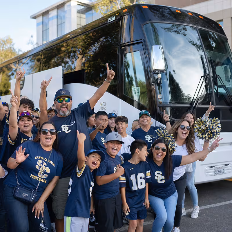 Passengers loading luggage while boarding an Santa Clarita group shuttle
