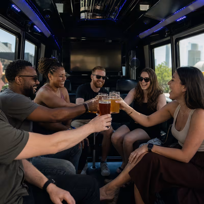 Group boarding a white charter bus for Winery & Brewery Tour Transportation transportation in Santa Clarita