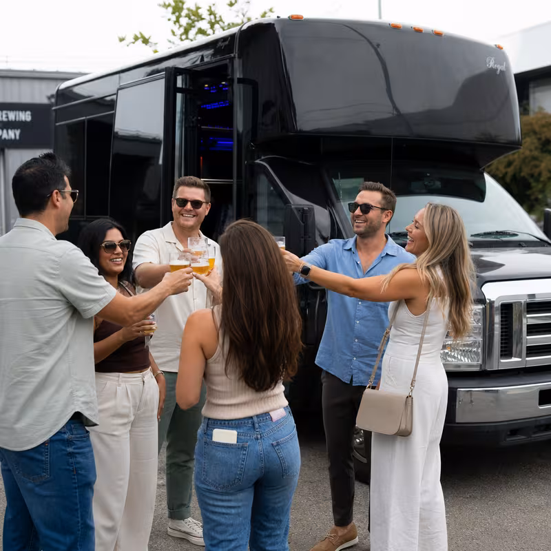 Passengers loading luggage while boarding an Santa Clarita group shuttle